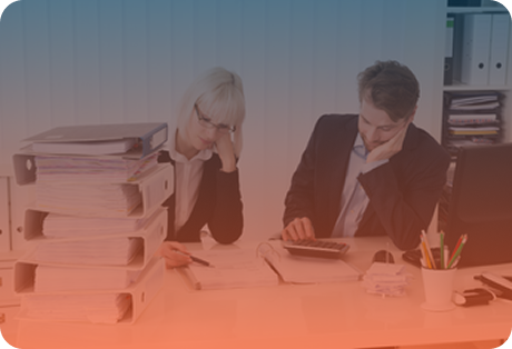 Office workers working through papers in an office